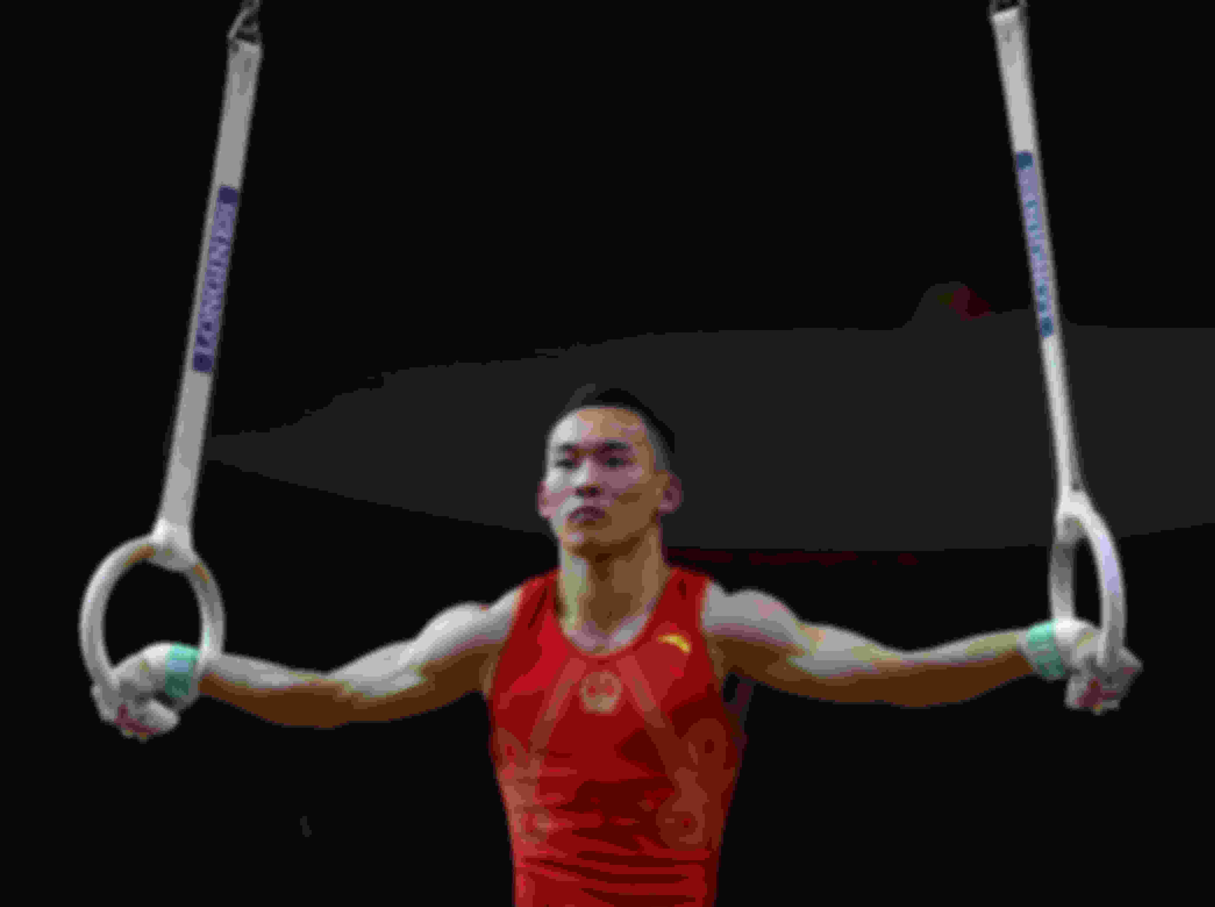 Defending champion Xiao Ruoteng scores 14.333 on the rings on his way to all-around silver in Doha