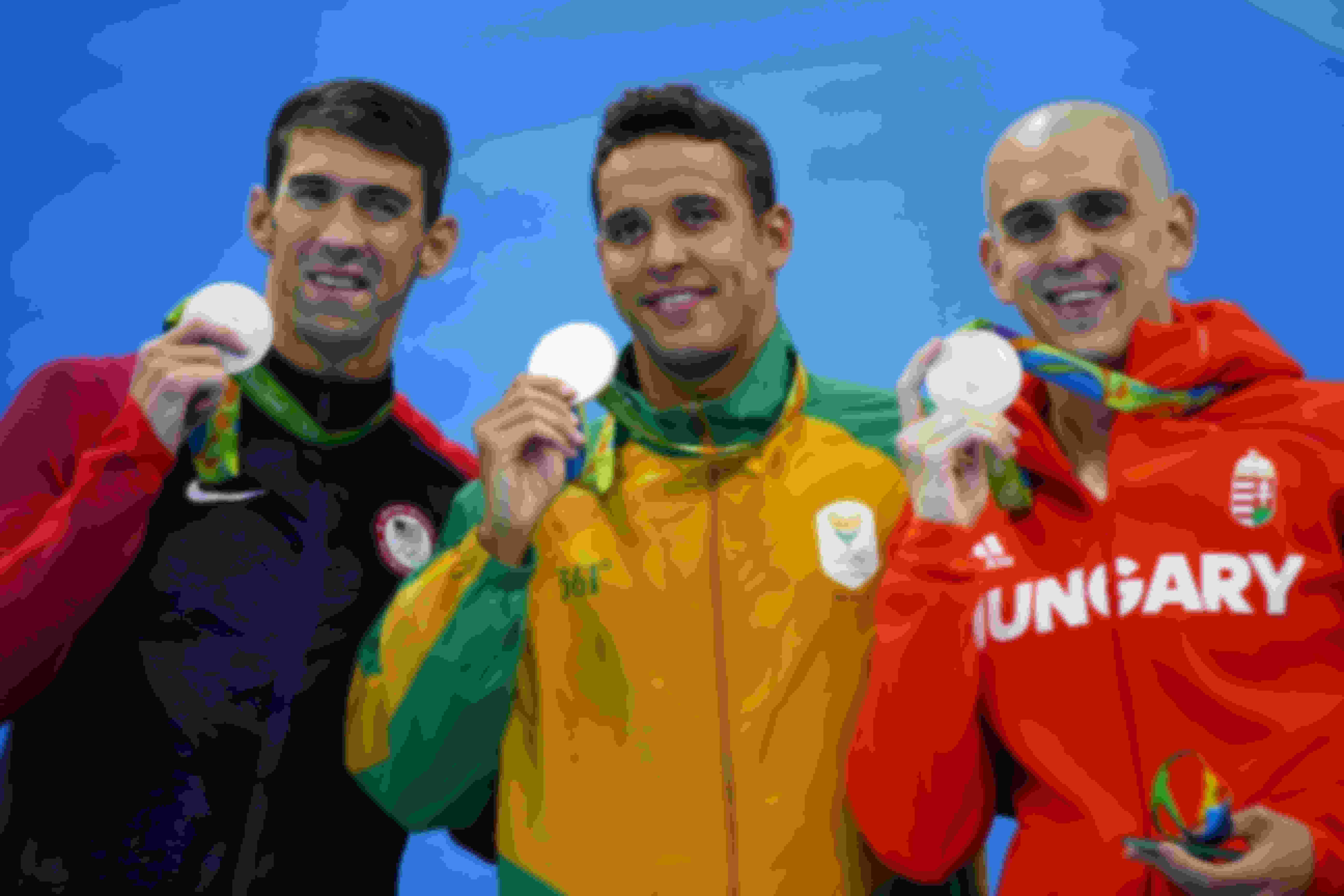 Michael Phelps (L), Chad le Clos (C) and Laszlo Cseh (R) celebrate winning joint silver in the 100m Butterfly at the Rio 2016 Olympic Games.