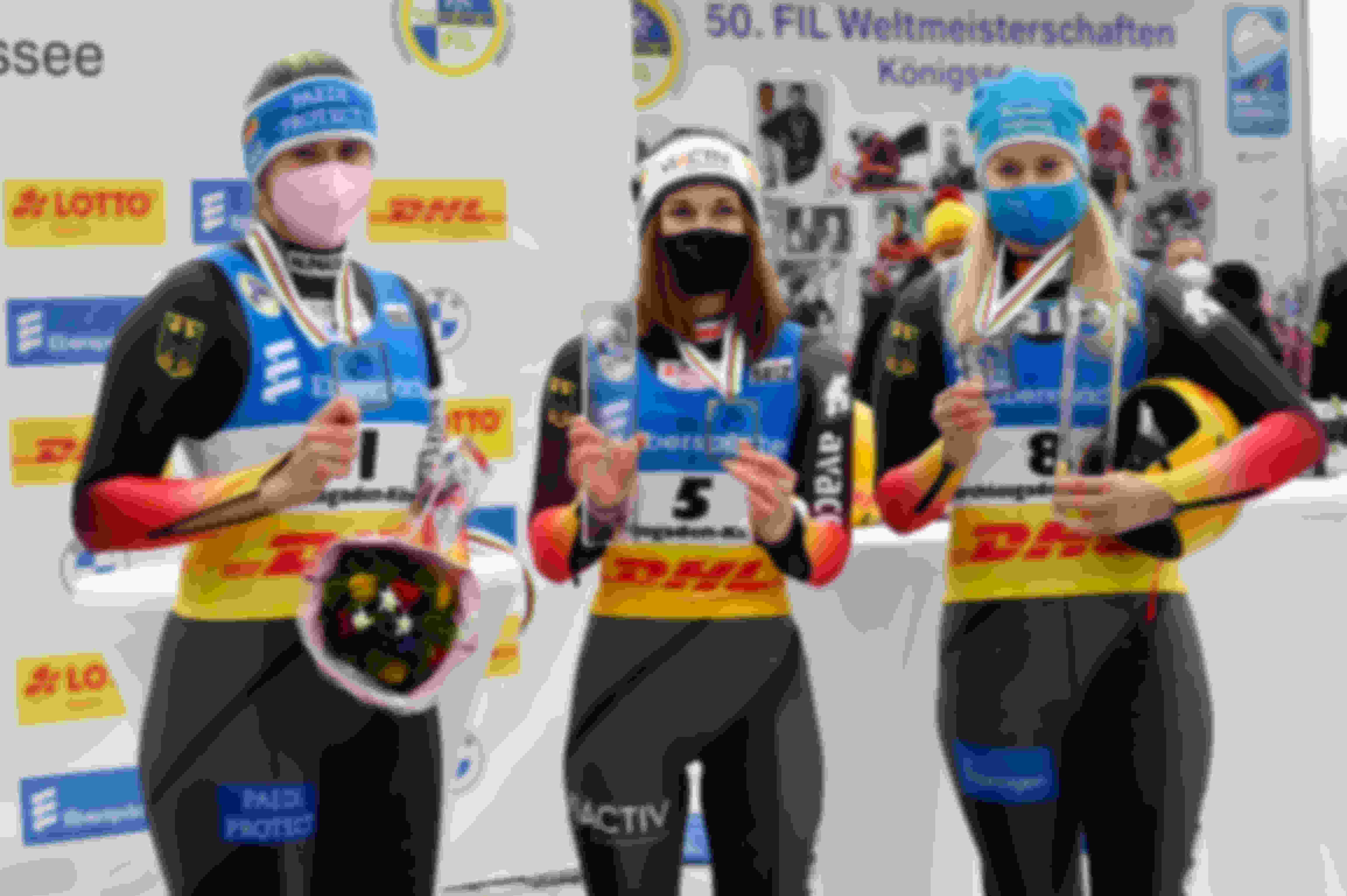 Natalie Geisenberger (Silver), Julia Taubitz (Gold) and Dajana Eitberger (bronze) of Germany celebrate after the Women's Singles event at the 2021 Luge World Championships in Koenigssee, Germany.