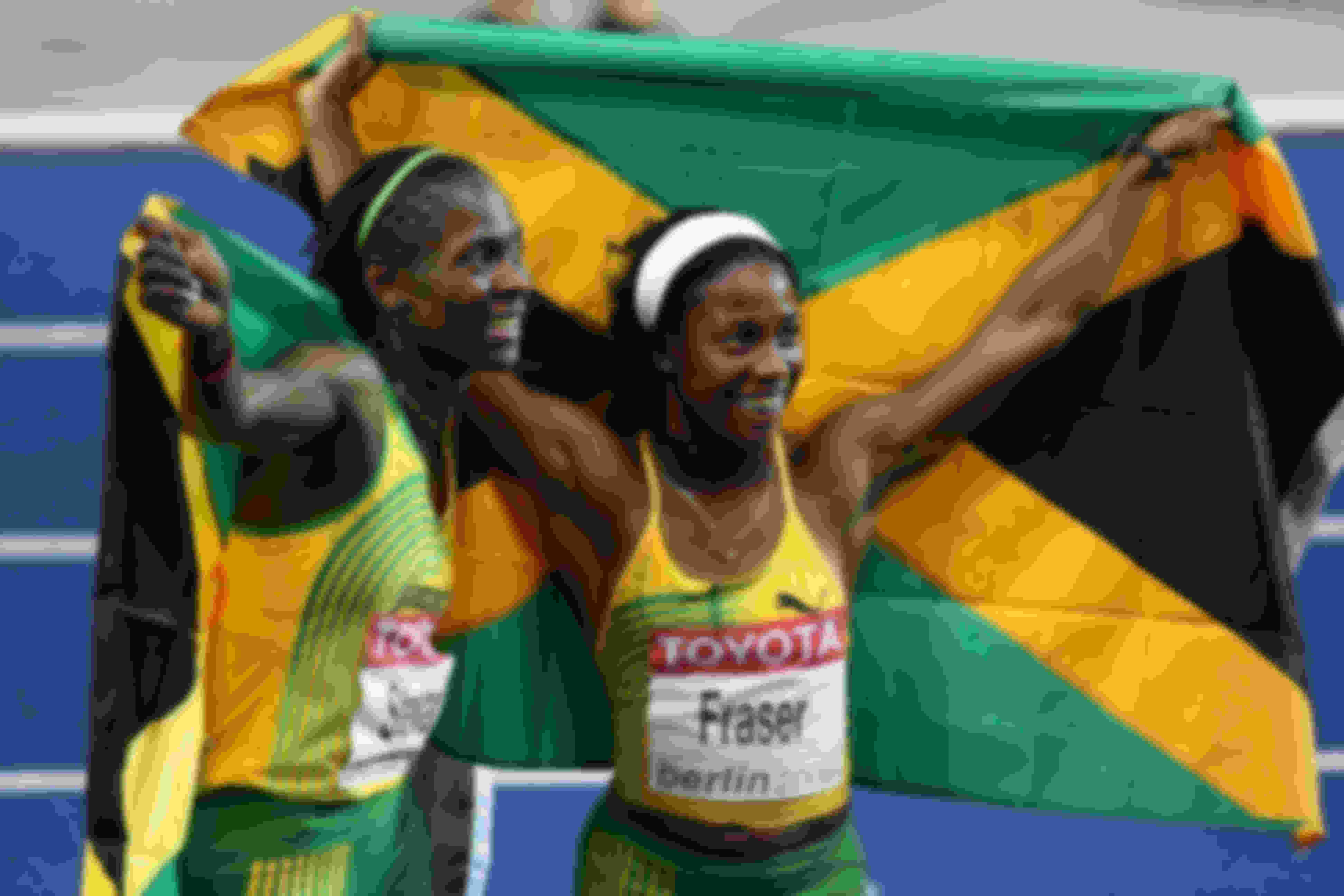 Kerron Stewart and Shelly-Ann Fraser celebrate Jamaica's 4x100m relay victory at the 2009 IAAF World Championships
