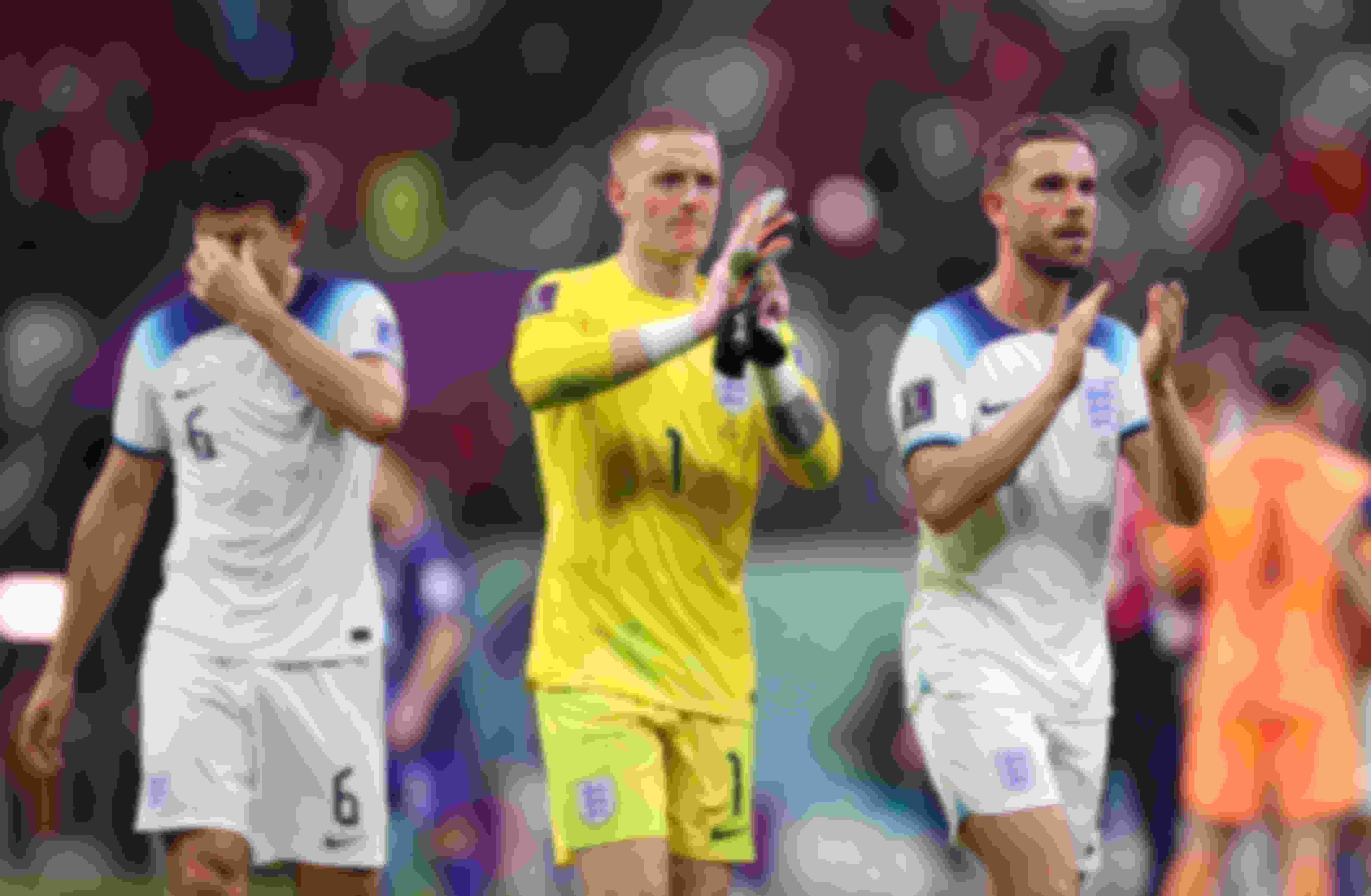 Jordan Pickford (L) and Jordan Henderson of England applaud fans after the 0-0 draw during the FIFA World Cup Qatar 2022 Group B match between England and USA at Al Bayt Stadium on November 25, 2022 in Al Khor, Qatar. 