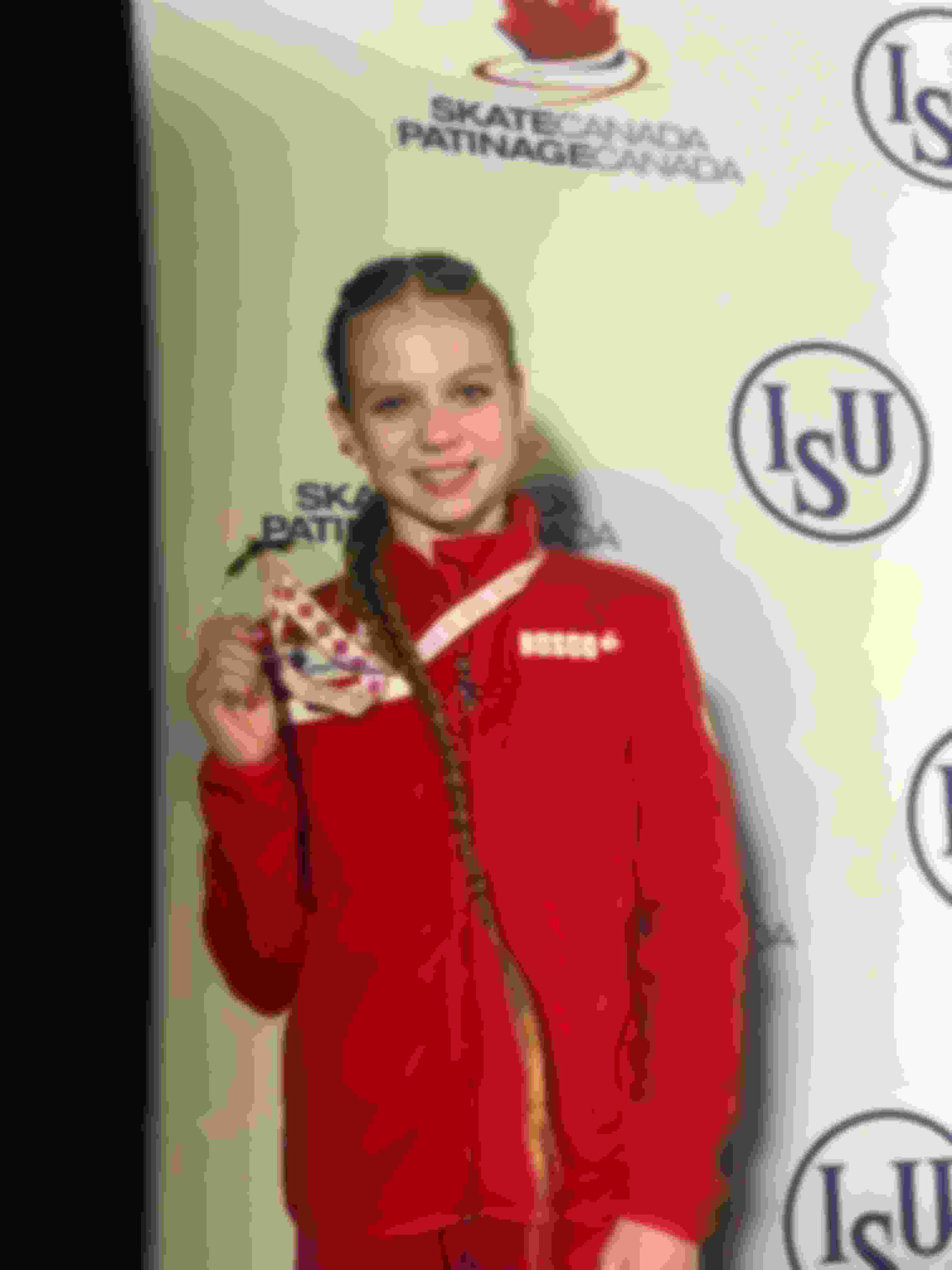 Alexandra Trusova with her Skate Canada winners medal