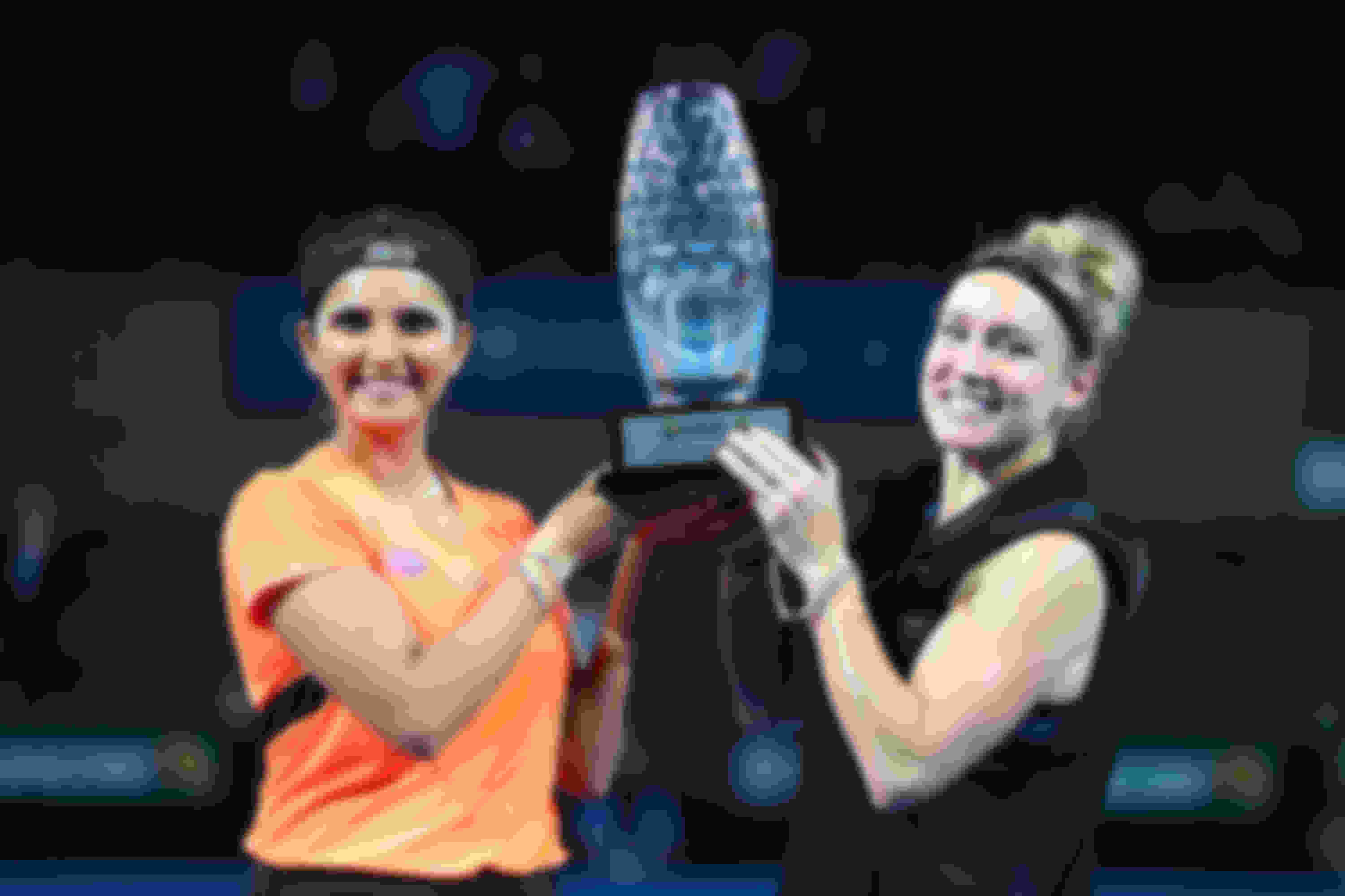 Sania Mirza and Bethanie Mattek-Sands pose with the Brisbane International women's doubles’ trophy