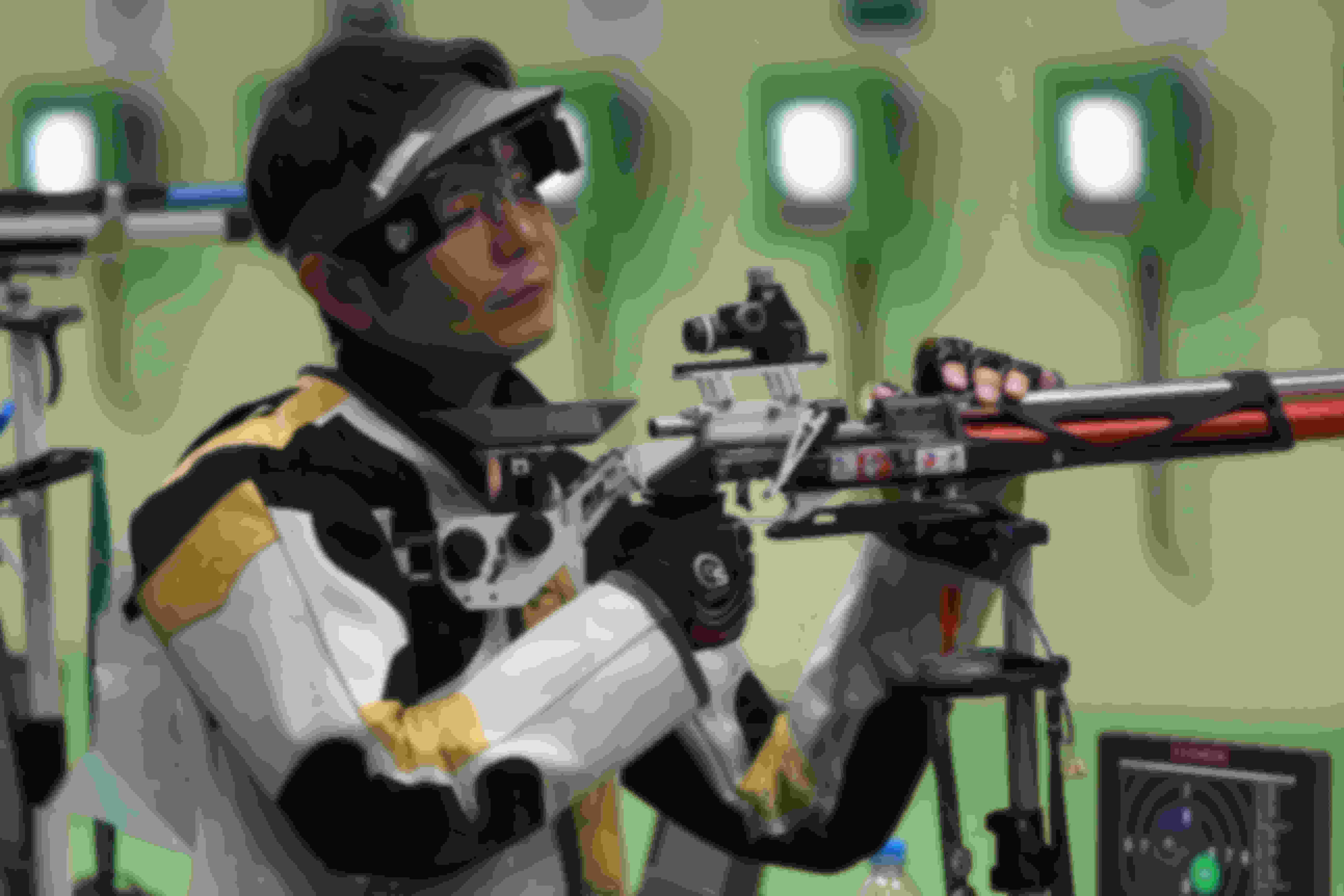 Rifle shooters wear a special jacket and blinders for stability and focus.