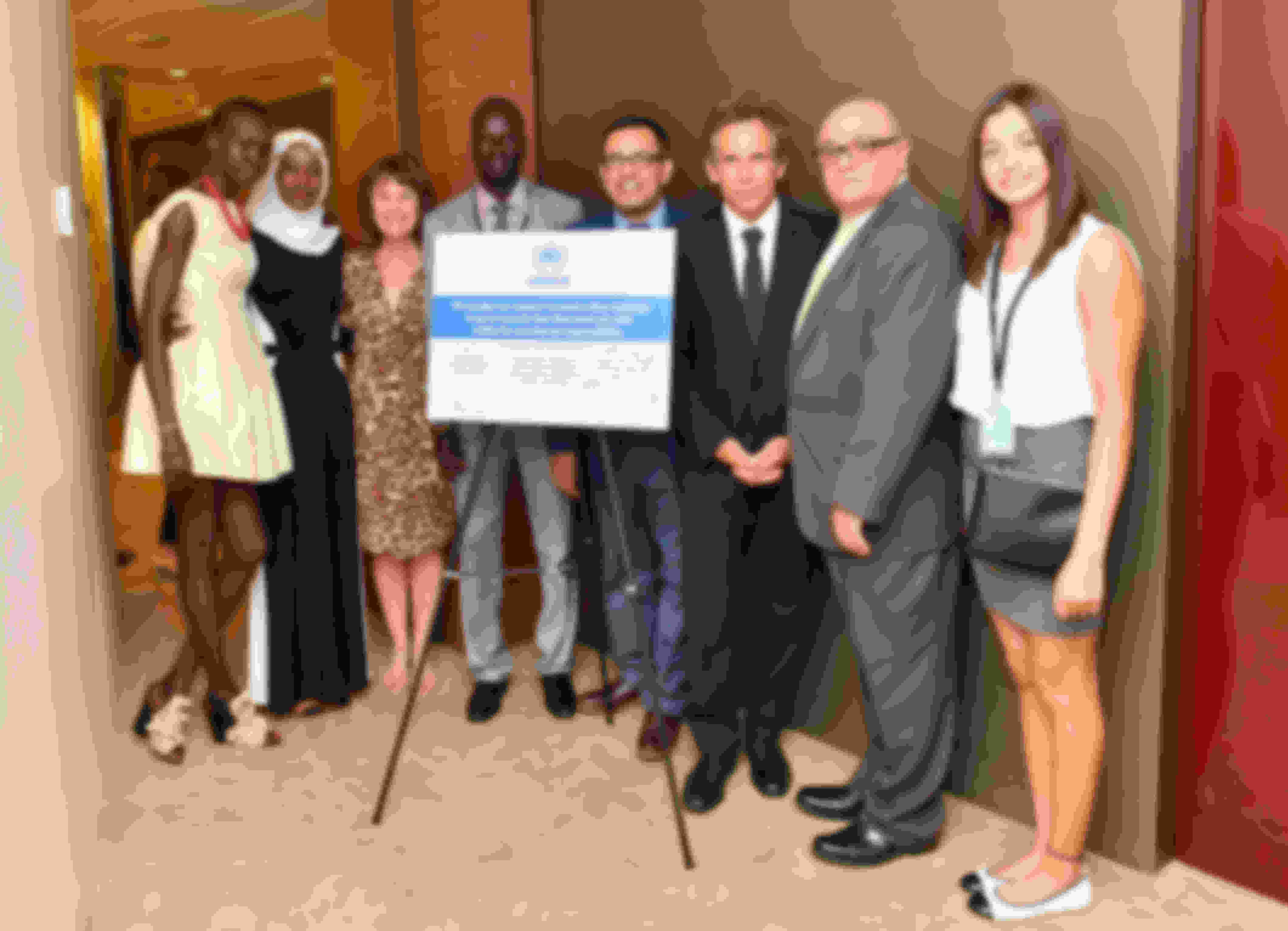 (L-R) Alek Wek, Emi Mahmoud, Ninette Kelly, Yiech Pur Biel, Tika Acharya, Ben Stiller, Esmail Dezhbod, and Yusra Mardini attend the 2016 UNHCR #WithRefugees petition handover at UN General Assembly Hall in New York City.