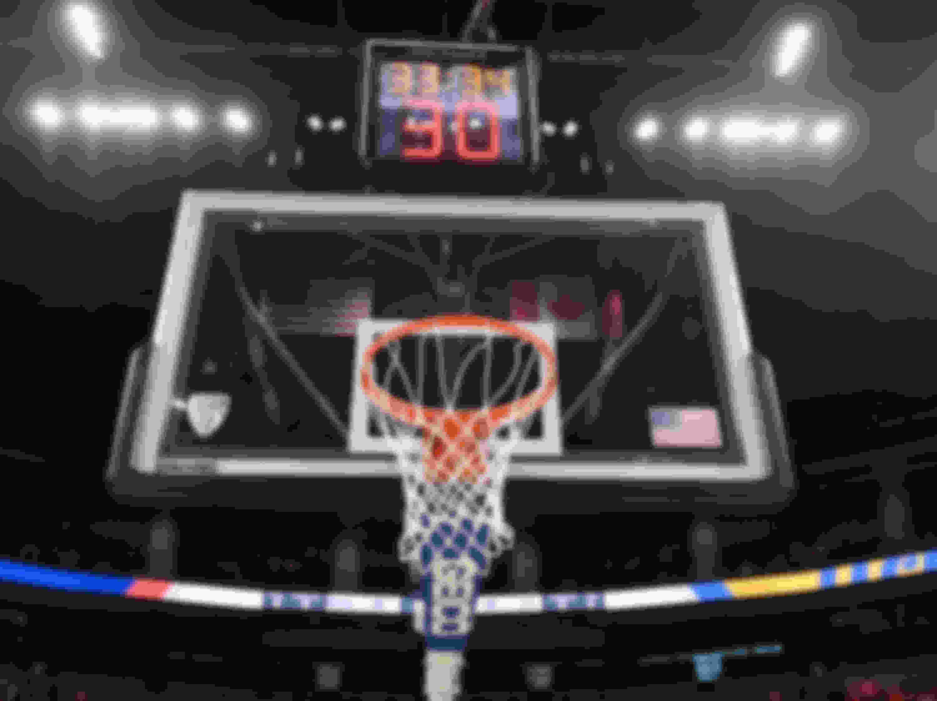 A Shot Clock stopwatch is typically displayed behind the basket during a basketball game.