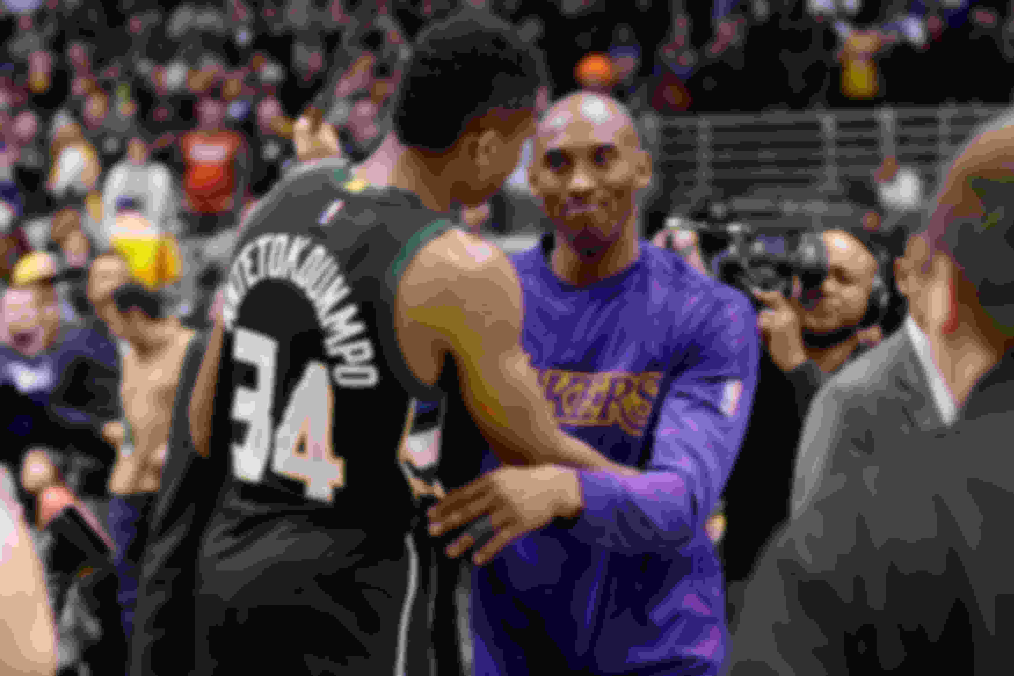 Kobe Bryant hugs Giannis Antetokounmpo after a Bucks v Lakers game in 2016.