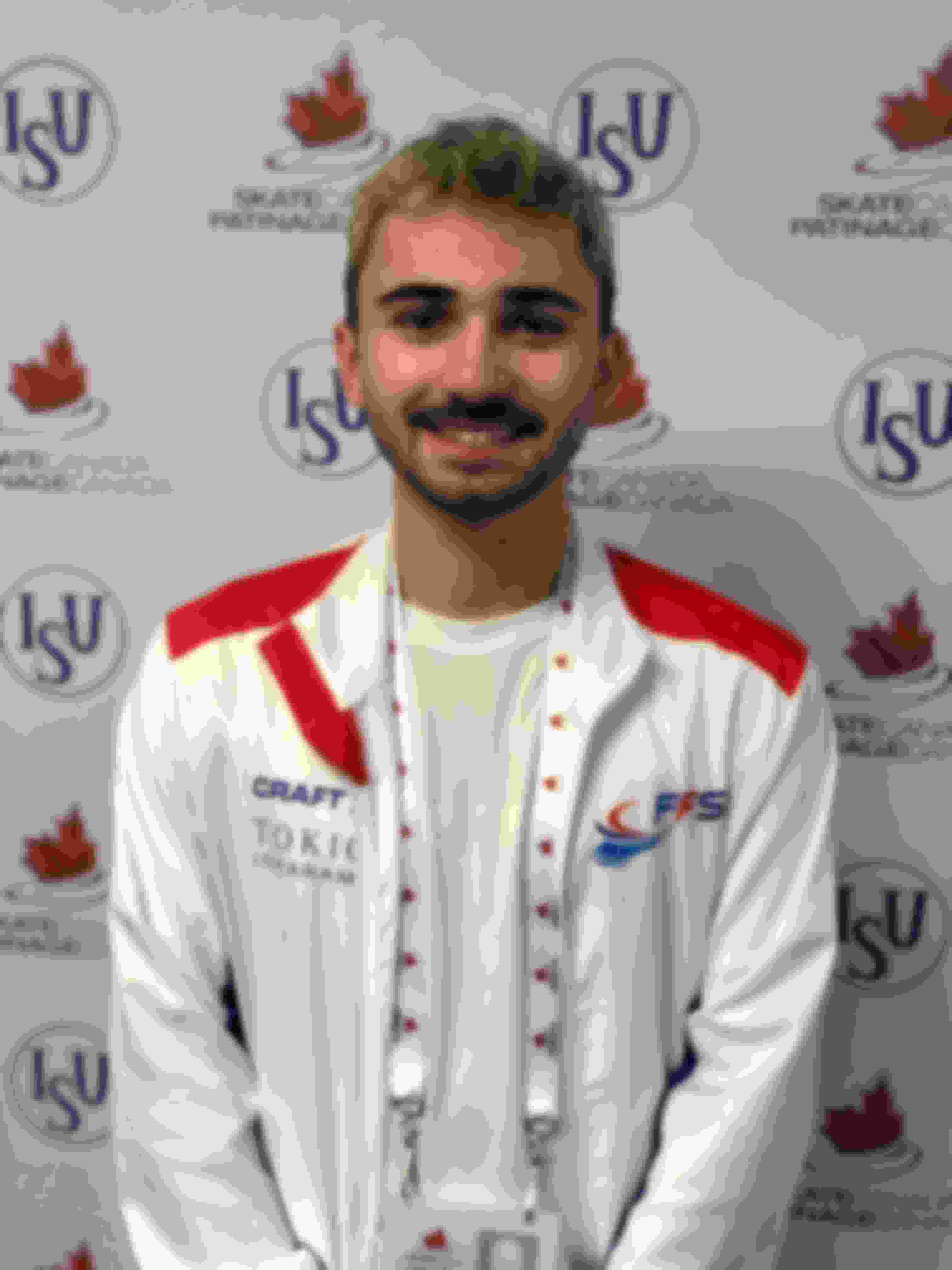 Short program runner-up Kevin Aymoz in the mixed zone at the Autumn Classic International