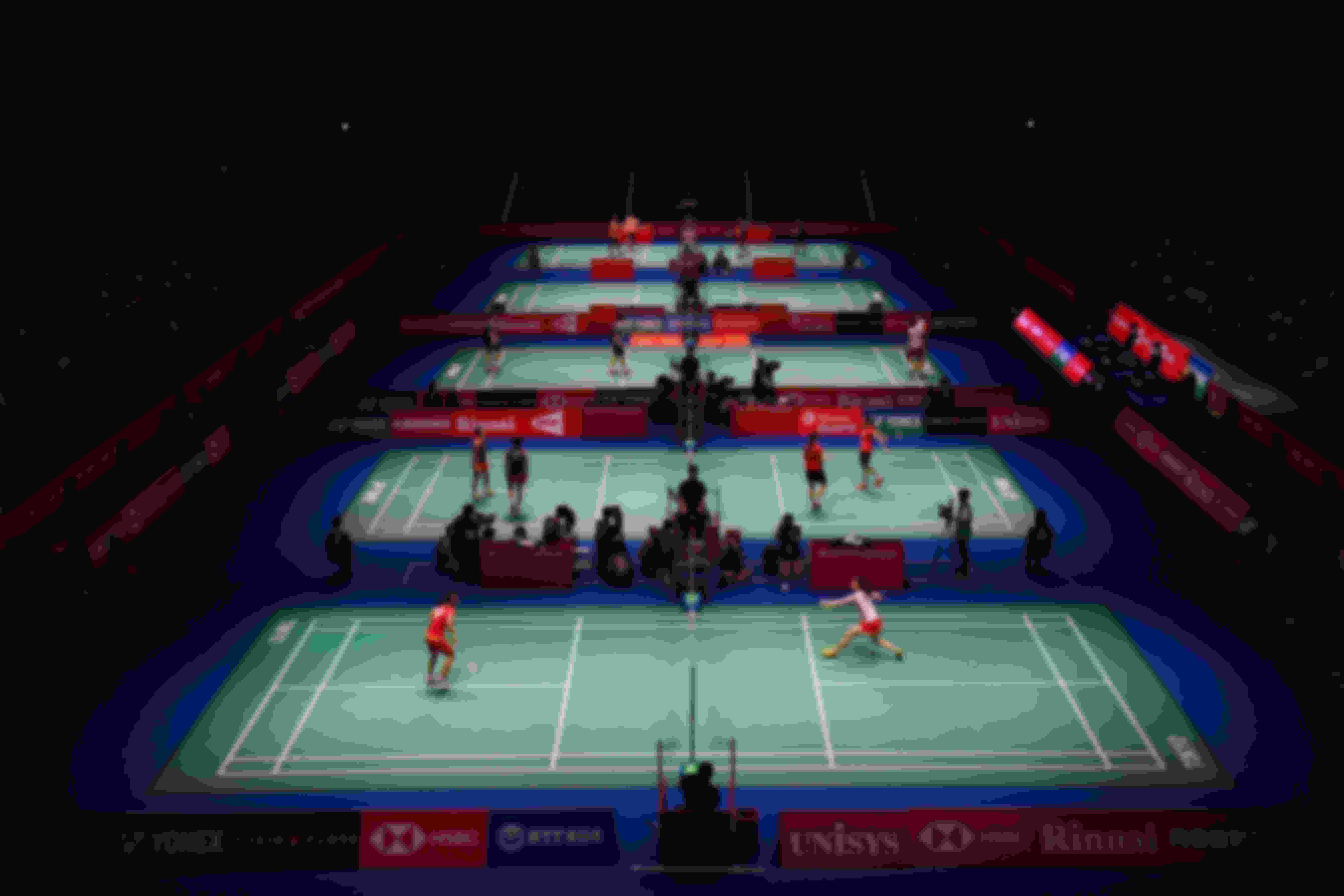 Action on badminton courts during the 2018 Japan Open