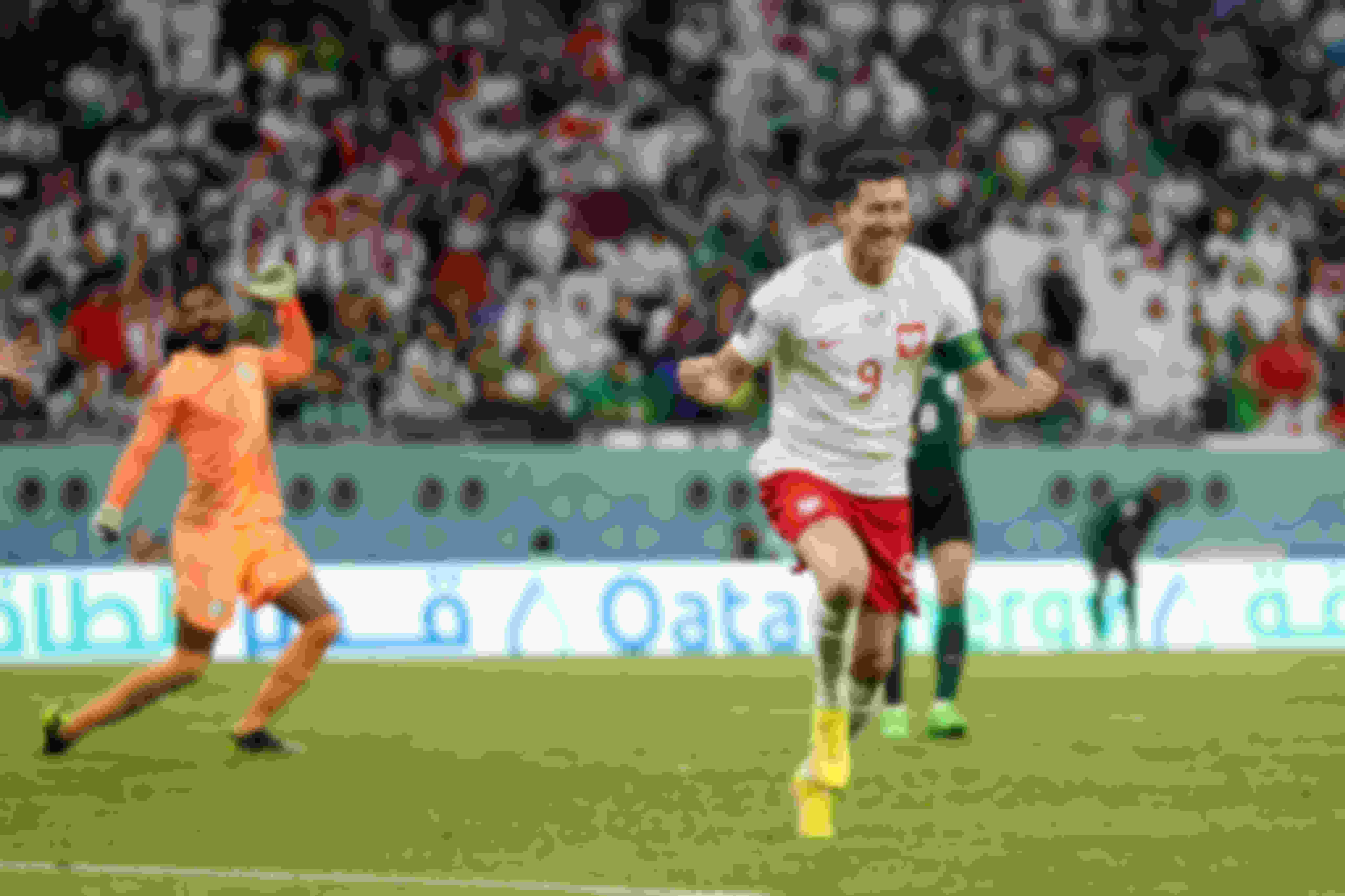 Robert Lewandowski celebrates scoring Poland's second goal against Saudi Arabia