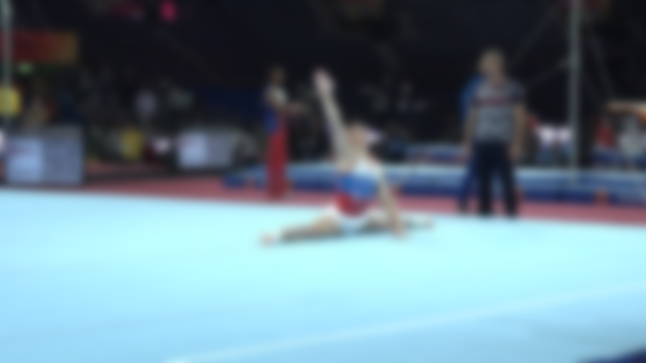 Nikita Nagornyy practices on floor in podium training