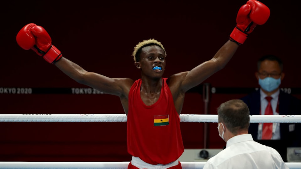 Samuel Takyi (red) of Team Ghana celebrates victory over Ceiber David Avila Segura of Team Colombia during the Men's Feather (52-57kg) quarter final on day nine of the Tokyo 2020 Olympic Games at Kokugikan Arena on August 01, 2021 in Tokyo, Japan. (Photo by Buda Mendes/Getty Images)