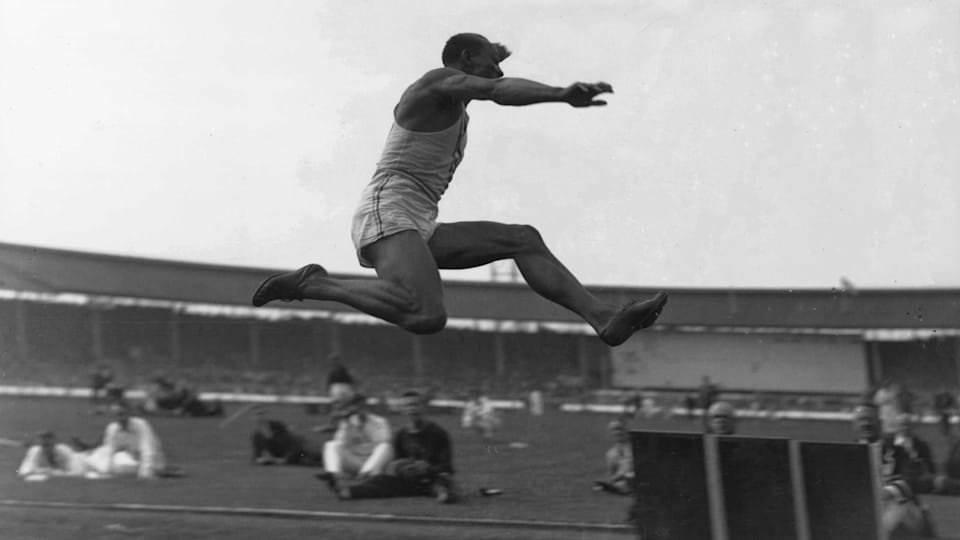 Jesse Owens jumps for gold