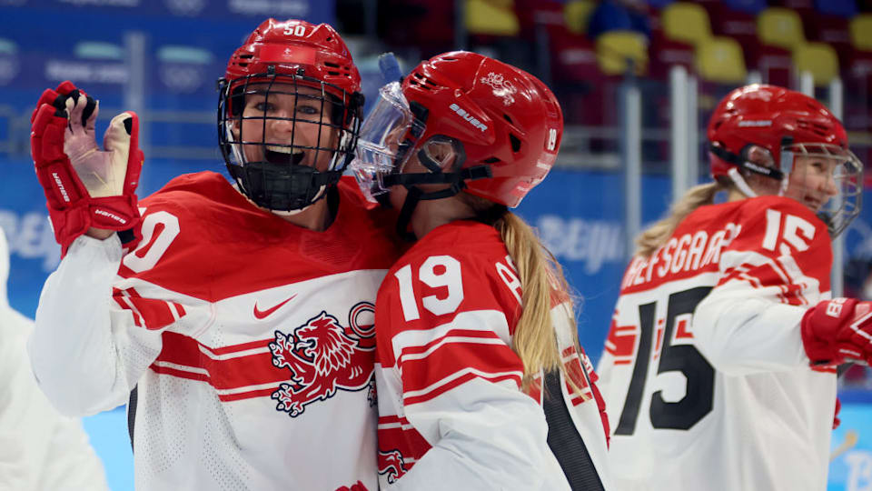 Mia Bau #50 and Josephine Asperup #19 of Team Denmark celebrate victory over of Team Czech Republic after the third period during the Women's Preliminary Round Group B match at Wukesong Sports Centre on February 07, 2022 in Beijing, China. (Photo by Bruce Bennett/Getty Images)