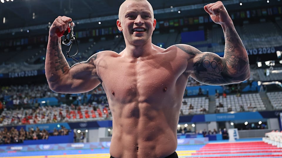 dam Peaty of Team Great Britain reacts after winning the gold medal in the Men's 100m Breaststroke Final on day three of Tokyo 2020