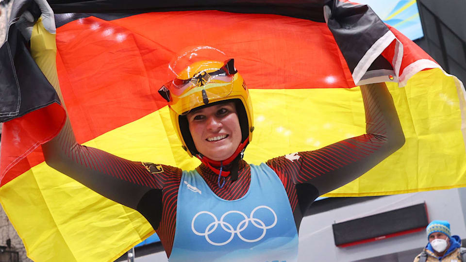 Natalie Geisenberger of Team Germany celebrates winning gold in the women's singles luge