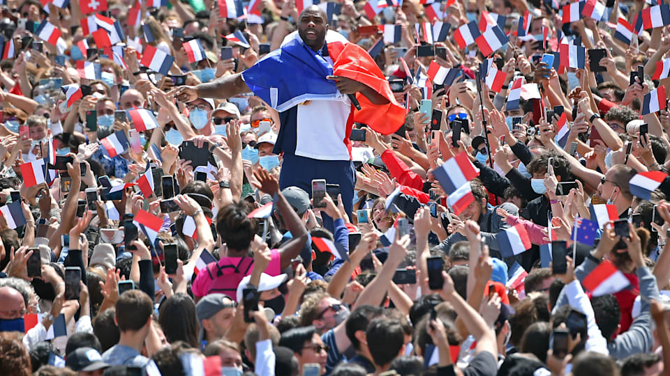French Olympic medalist Teddy Riner walks through the crowd during the Olympic Games handover ceremony on August 08, 2021 in Paris, France.