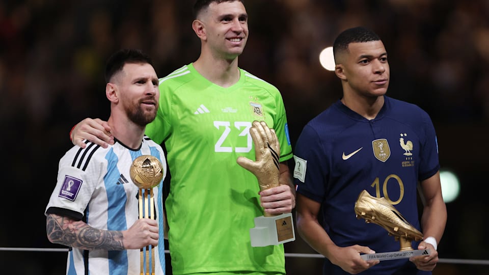 (L-R): Golden Ball winner Lionel Messi, Golden Glove winner Emi Martinez, Golden Boot winner Kylian Mbappe