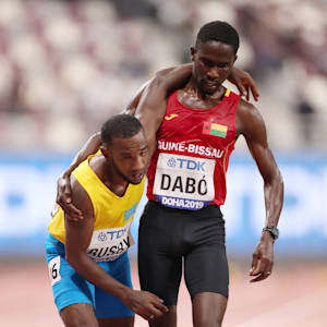Braima Suncar Dabo and Jonathan Busby at the finish of their 5000m heat in Doha