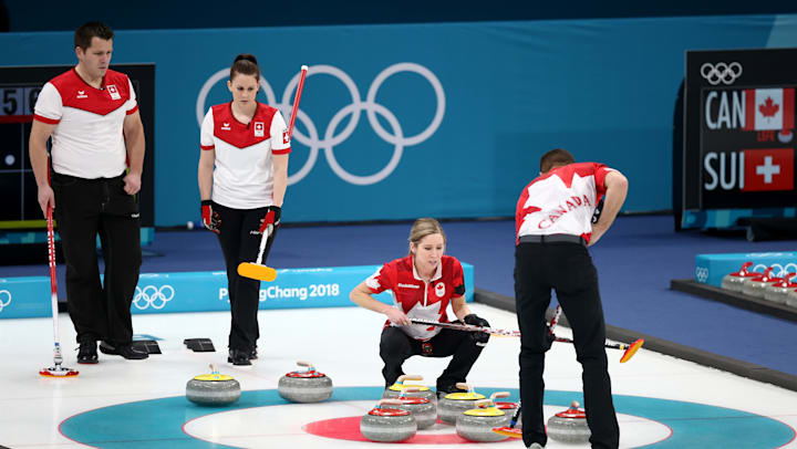 Jenny Perret and Martin Rios of Switzerland compete against Kaitlyn Lawes and John Morris of Canada during the Curling Mixed Doubles Gold Medal Game at PyeongChang 2018.