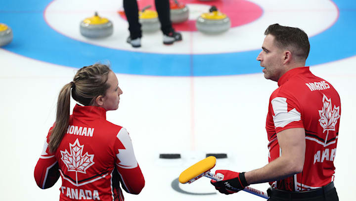 Rachel Homan and John Morris in discussion for Team Canada at Beijing 2022