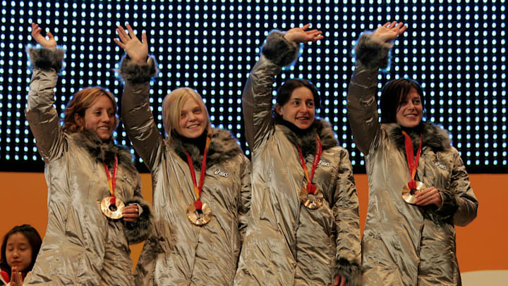 Marta Capurso, Arianna Fontana, Katia Zini and Mara Zini, of the Italian short track team, receive the Bronze medal in the women's 3000 metres relay in Turin 2006