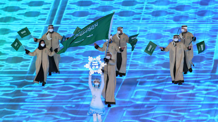 Flagbearer Fayik Abdi leads Team Saudi Arabia during the Beijing 2022 Opening Ceremony