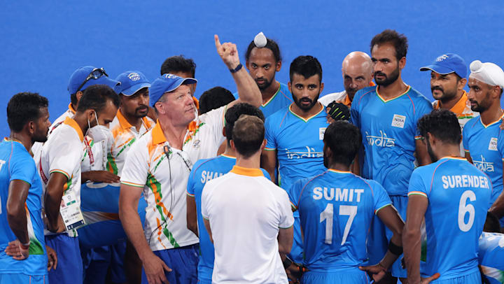 Who is the Indian men's hockey team coach?
