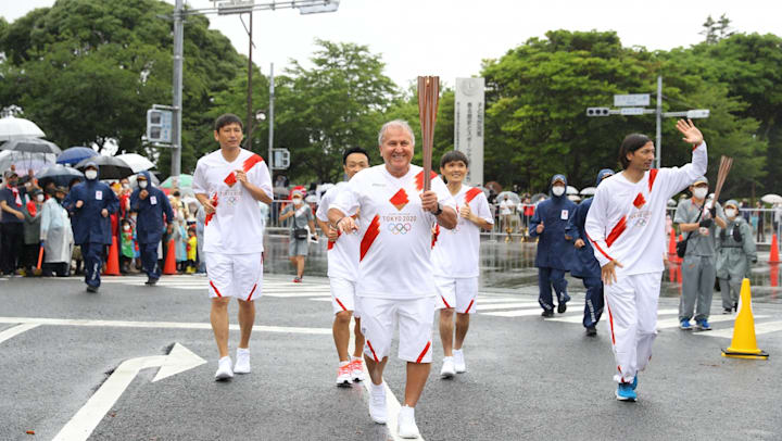 Brazil World Cup Star Zico Carries The Olympic Flame Alongside Former Japan Internationals