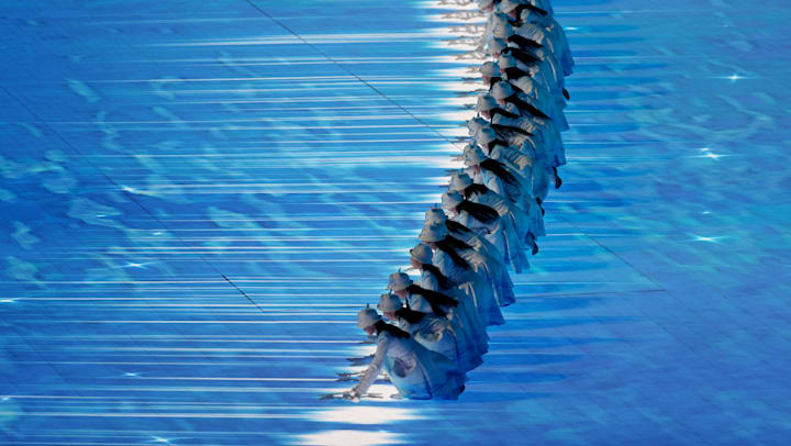 General View inside the stadium as performers place down snowflakes with the names of participating countries on during the Opening Ceremony of the Beijing 2022 Winter Olympic Games