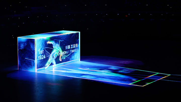 A projection display shows previous Winter Olympic games information during the Opening Ceremony of the Beijing 2022 Winter Olympic Games