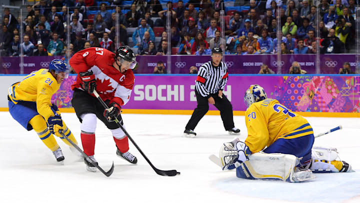Sidney Crosby #87 of Canada scores in the men's ice hockey gold medal match at Sochi 2014