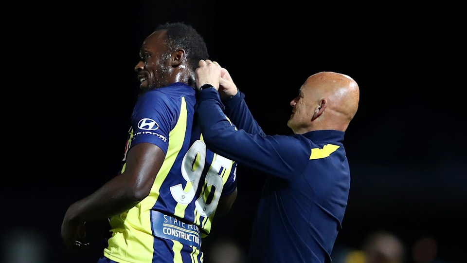 Bolt's football debut in pictures