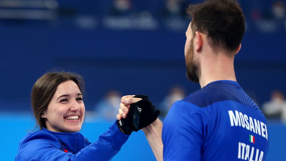 A warm reception for Stefania Constantini as she brings home curling gold