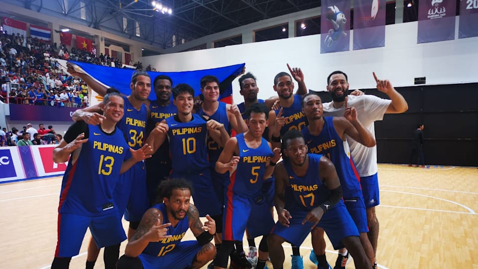 Philippine's men's basketball team celebrate after winning gold at the 2023 SEA Games
