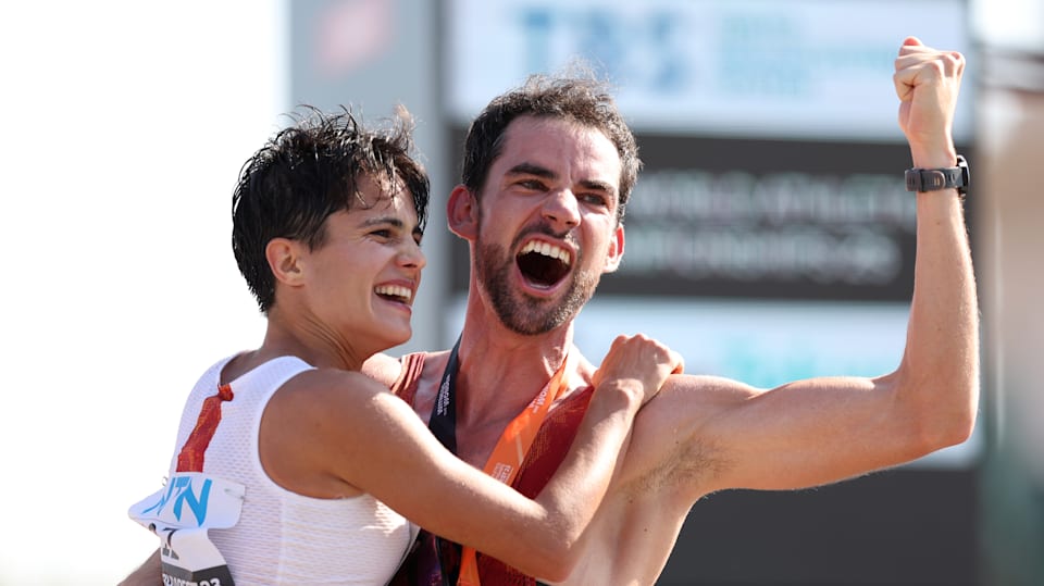 Gold medalists Maria Perez of Team Spain and Alvaro Martin of Team Spain celebrate after winning their Men's and Women's 35 Kilometres Race Walk Finals during day six of the World Athletics Championships Budapest