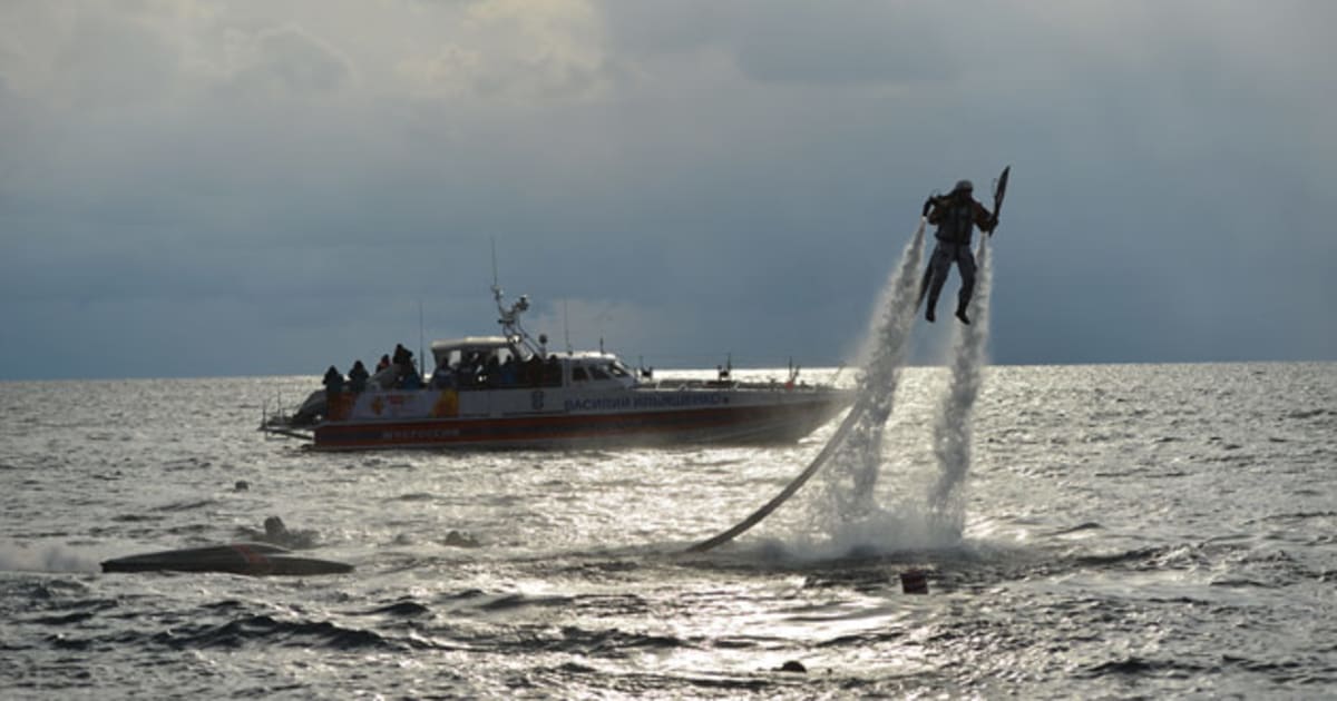 Olympic flame carried underwater in world’s deepest lake Olympic News