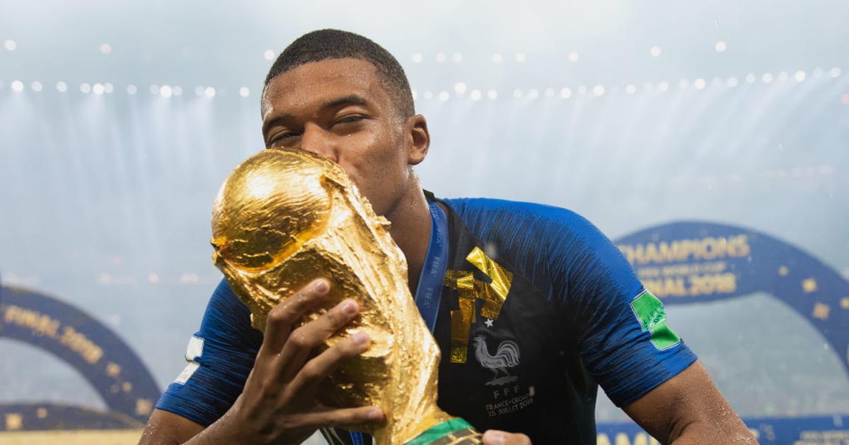 messi holding fifa world cup