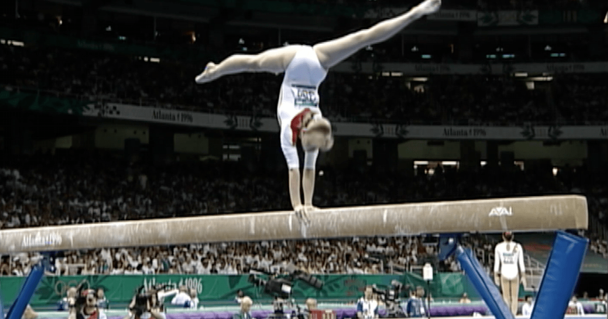Team Romania performs their compulsory balance beam routines at Atlanta